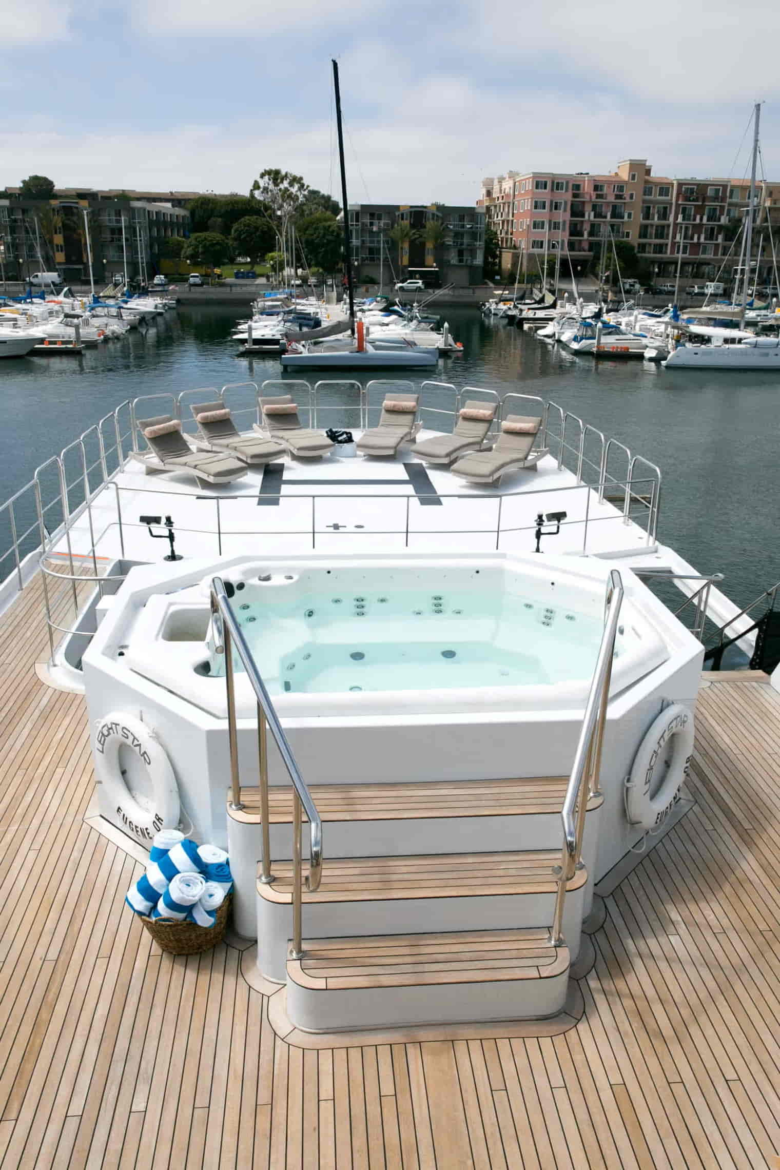 Guests enjoying the jacuzzi and decks aboard Aurora