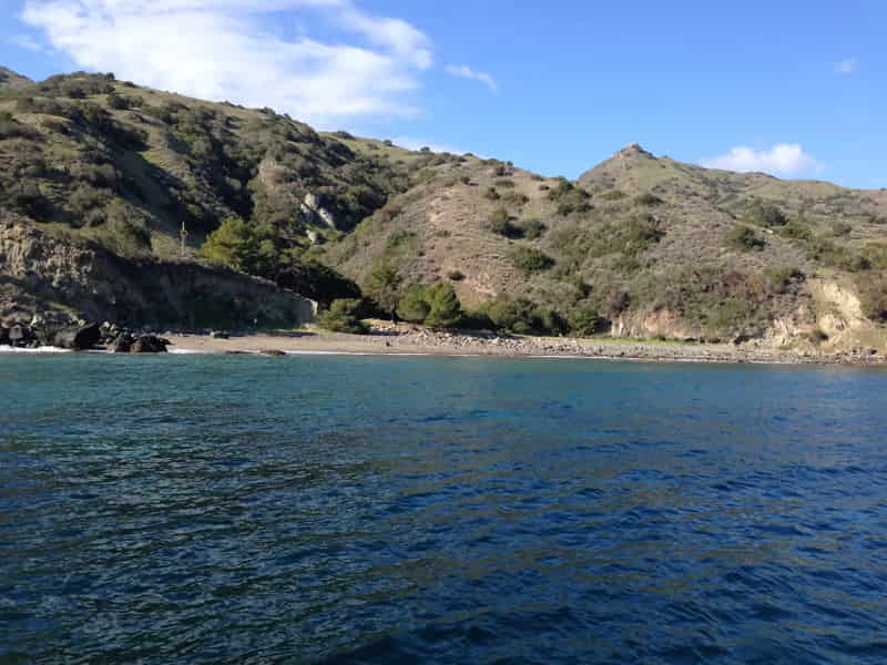 Narrow beach and steep canyon walls at Rippers Cove, Catalina Island
